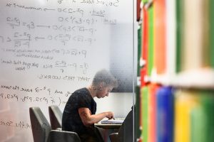 A student studies in the Wisconsin School of Business Library in Grainger Hall at the University of Wisconsin-Madison on Feb. 22, 2019. (Photo by Jeff Miller / UW-Madison)