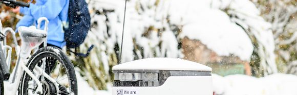 A University Housing food delivery robot is pictured on a sidewalk near Sewell Social Sciences during an early-season snowstorm at the University of Wisconsin-Madison on Oct. 31, 2019. (Photo by Bryce Richter /UW-Madison)