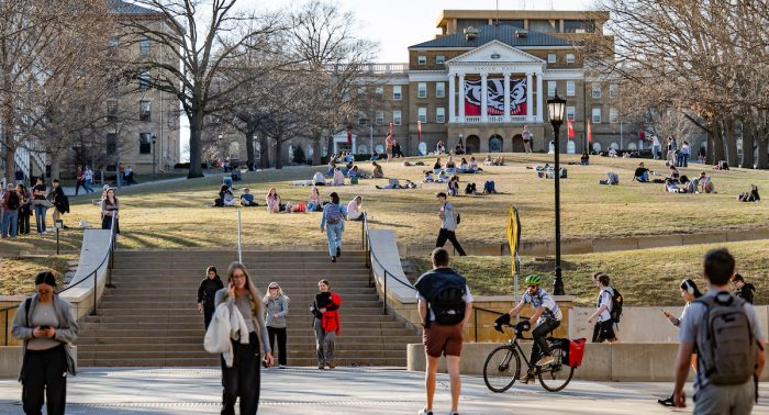 UW students flock to Bascom Hill to study, socialize, and sunbathe during an early celebration of spring as the temperature soared to nearly 70 degrees at the University of Wisconsin–Madison on March 9, 2026. This “false spring” was short lived with temperatures expected to fall back below freezing later in the week. (Photo by Taylor Wolfram / UW–Madison)