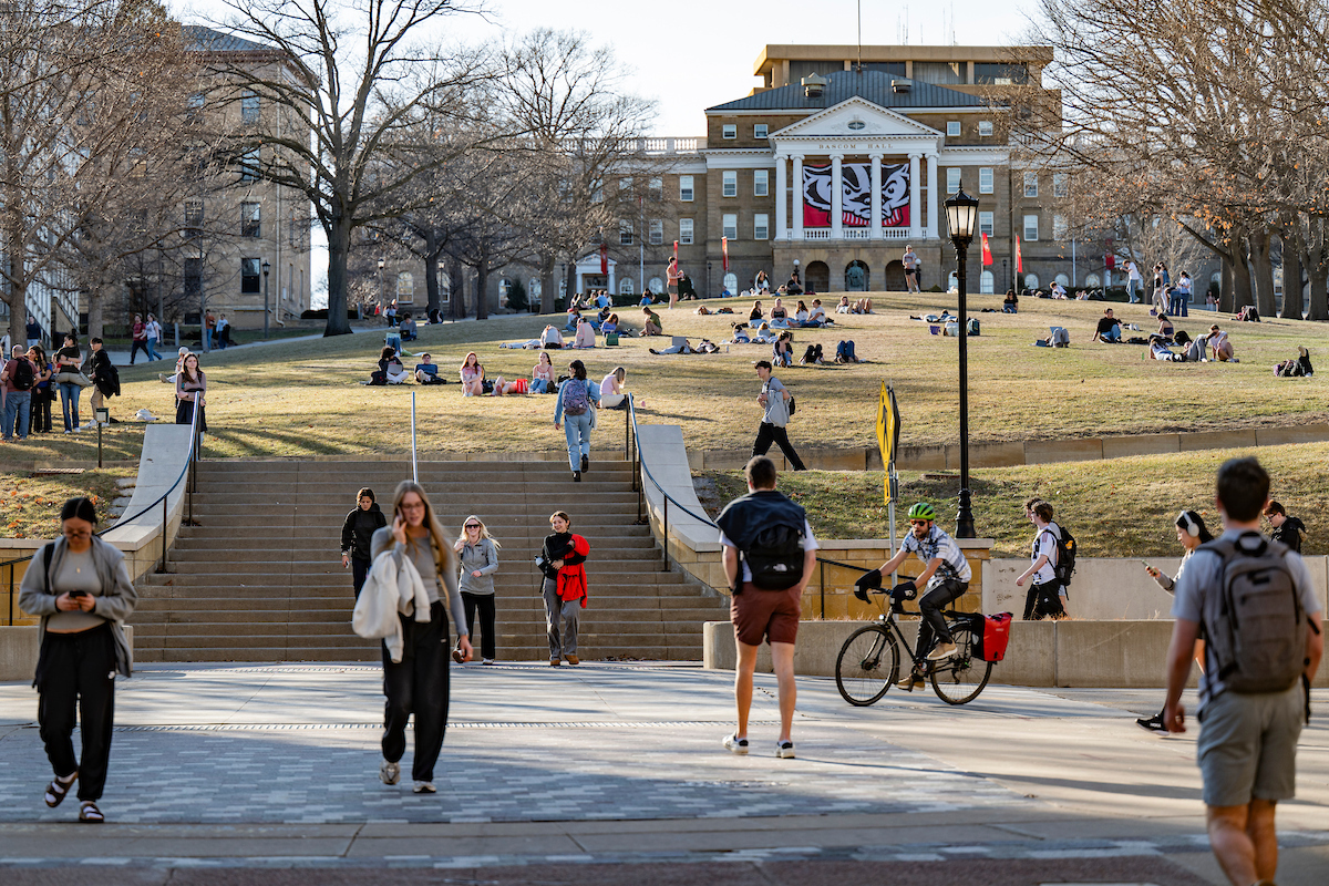 UW students flock to Bascom Hill to study, socialize, and sunbathe during an early celebration of spring as the temperature soared to nearly 70 degrees at the University of Wisconsin–Madison on March 9, 2026. This “false spring” was short lived with temperatures expected to fall back below freezing later in the week. (Photo by Taylor Wolfram / UW–Madison)